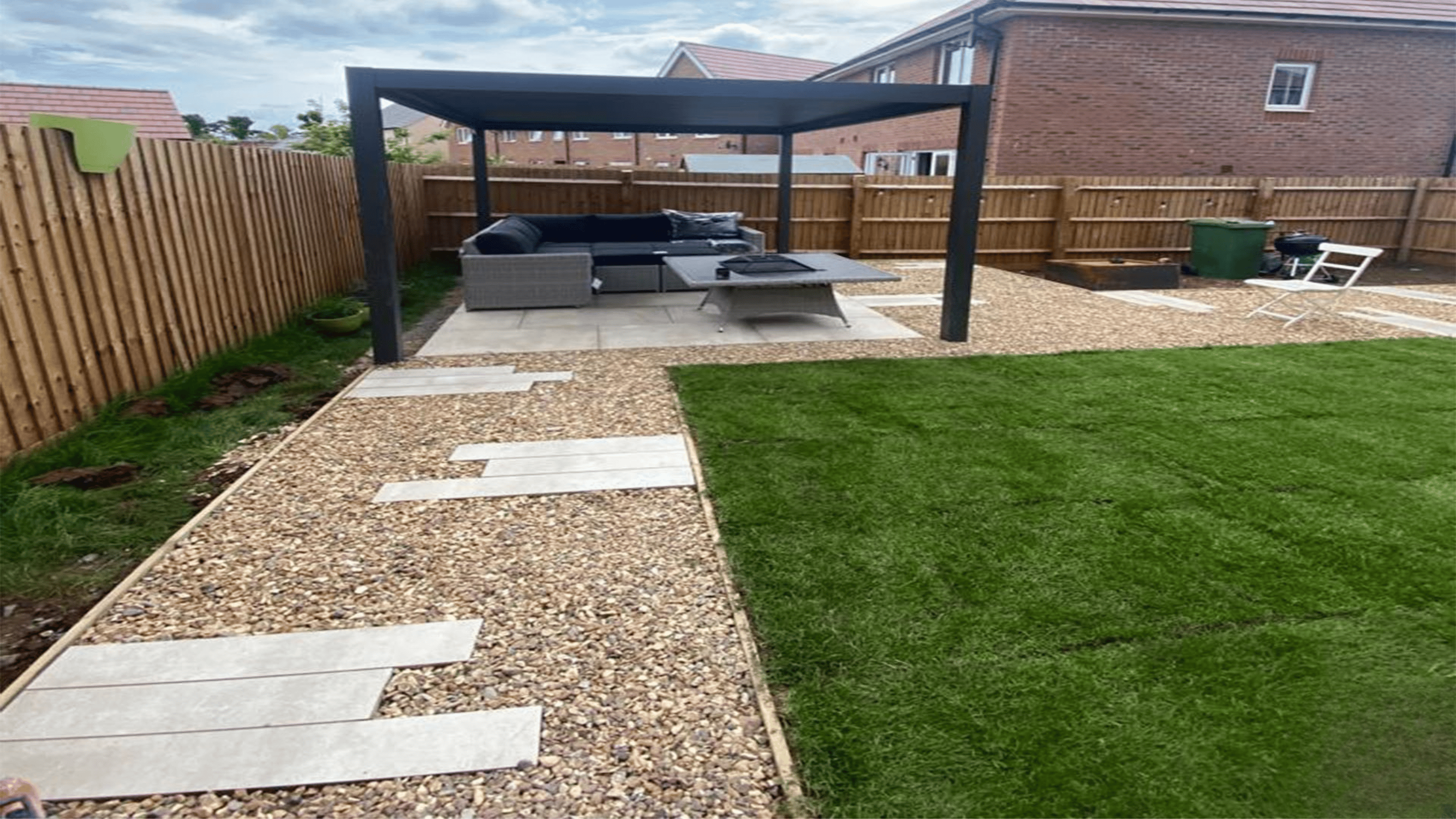 Modern front garden featuring clean lines, gravel borders, low-maintenance planting, and a stylish pathway leading to the entrance